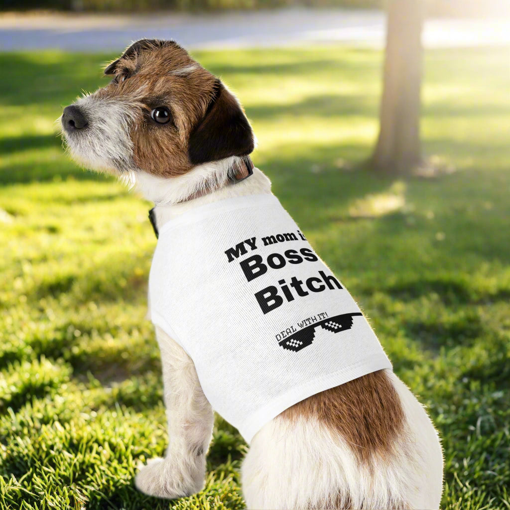 Dog wearing a white sleeveless shirt with text on a white background